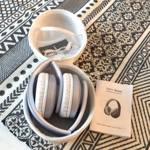 TUINY headphones new in case.